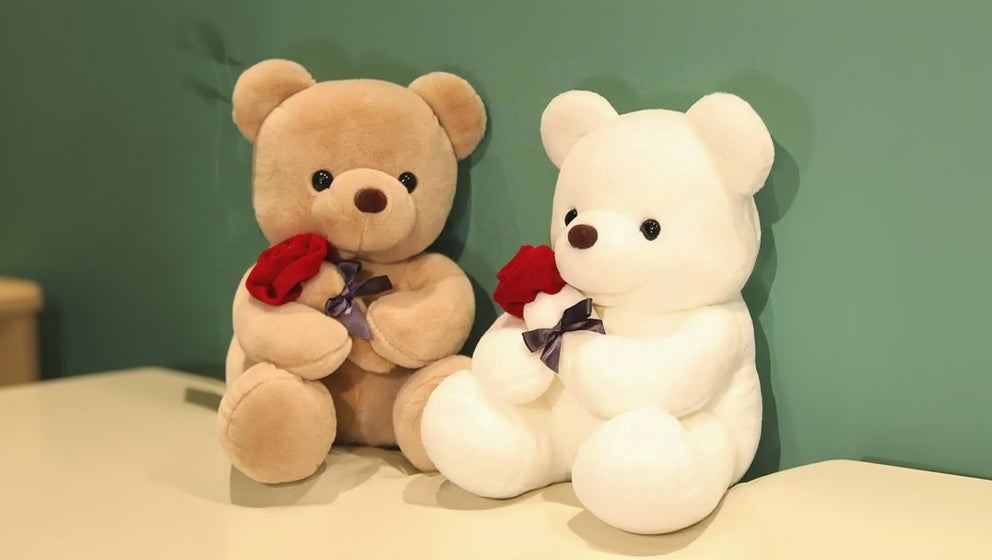 Oso de peluche con rosa
