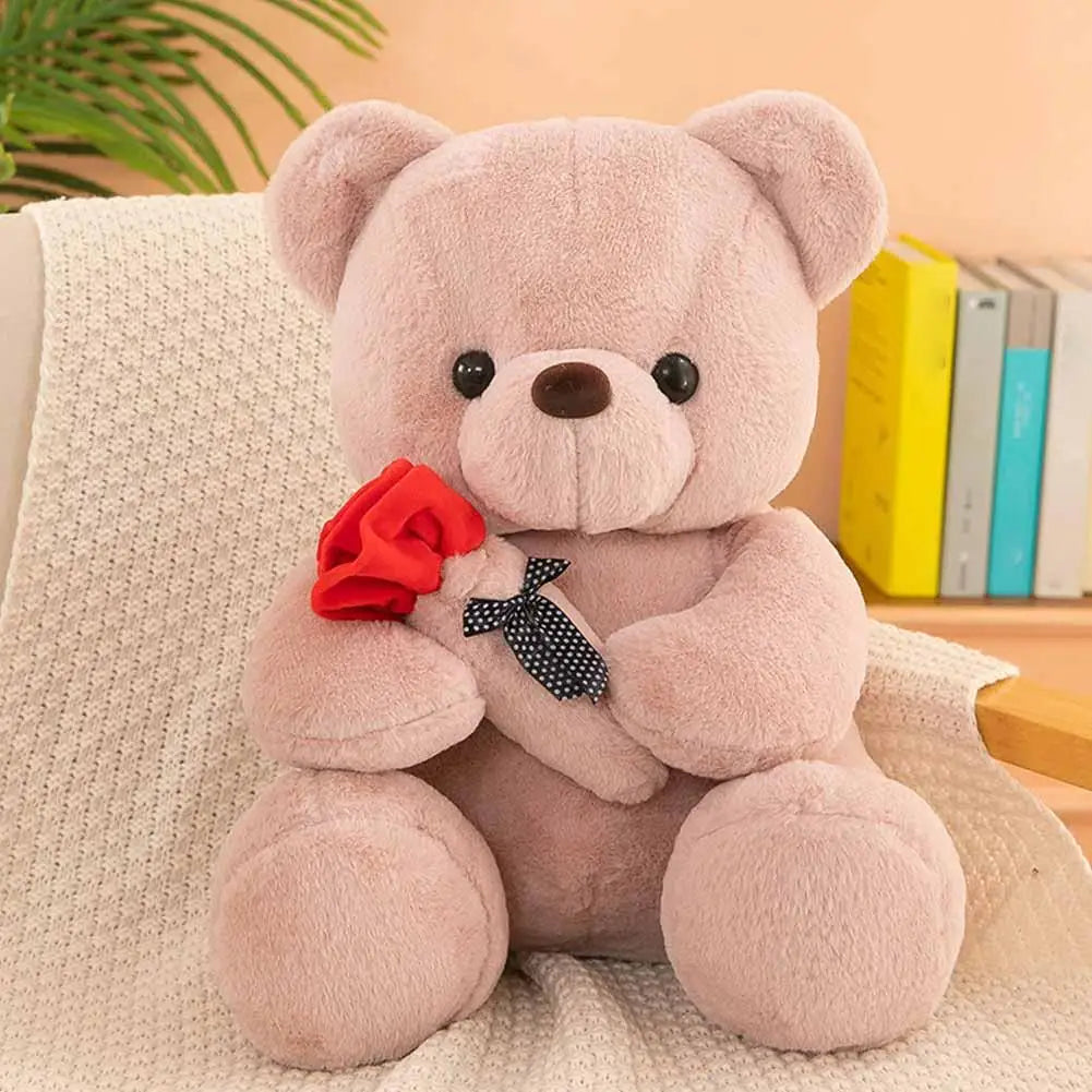 Oso de peluche con rosa